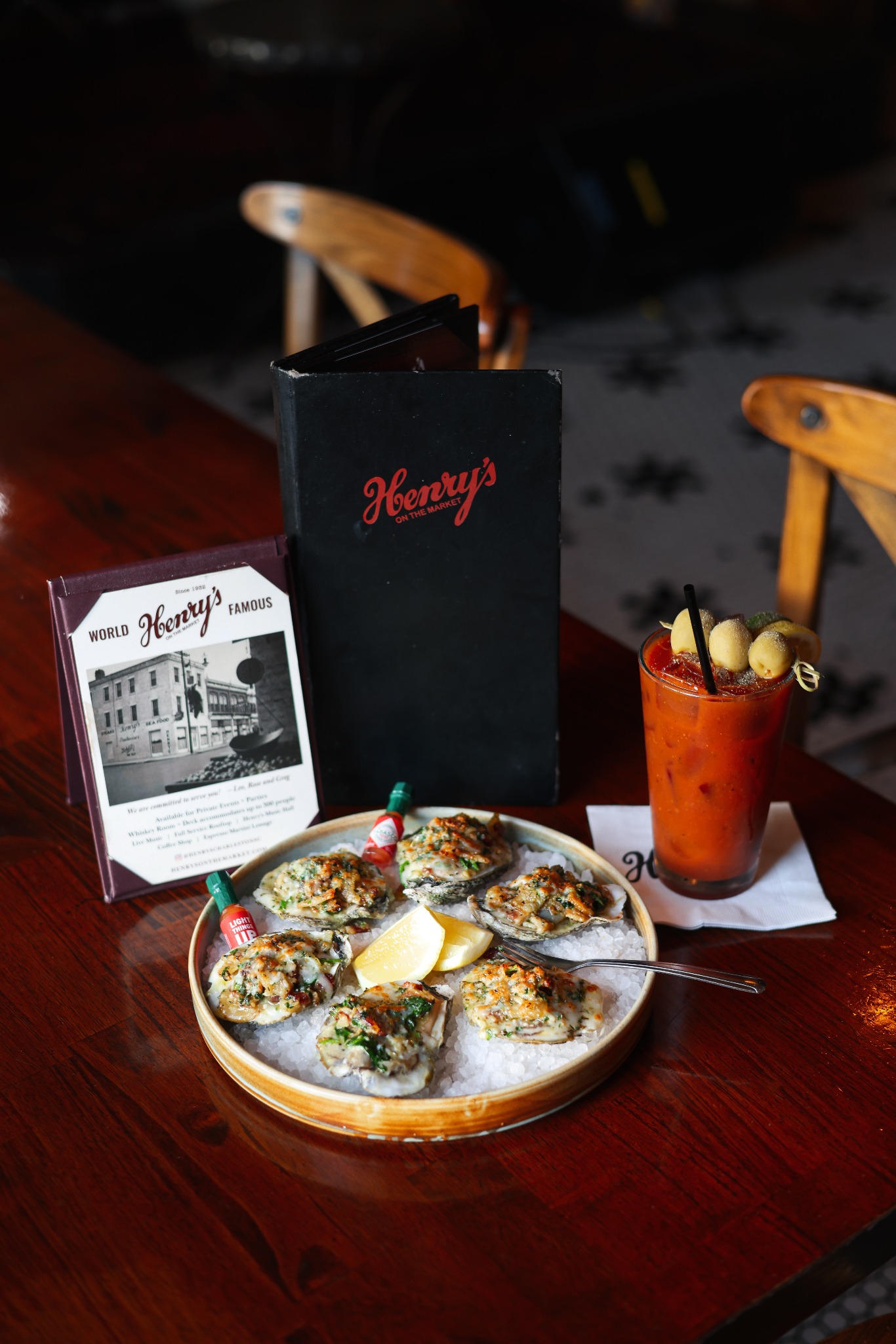 Oysters, a cocktail and menus at Henry’s